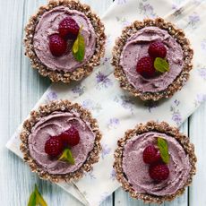 Mini raspberry and coconut cream tarts photo