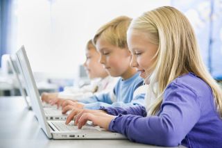 Schoolkids Working on Laptops