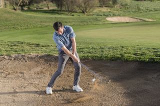 Dan Grieve plays a greenside bunker shot