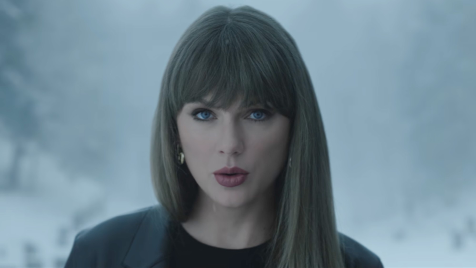 Taylor Swift looking serious in the Patient Zero music video.