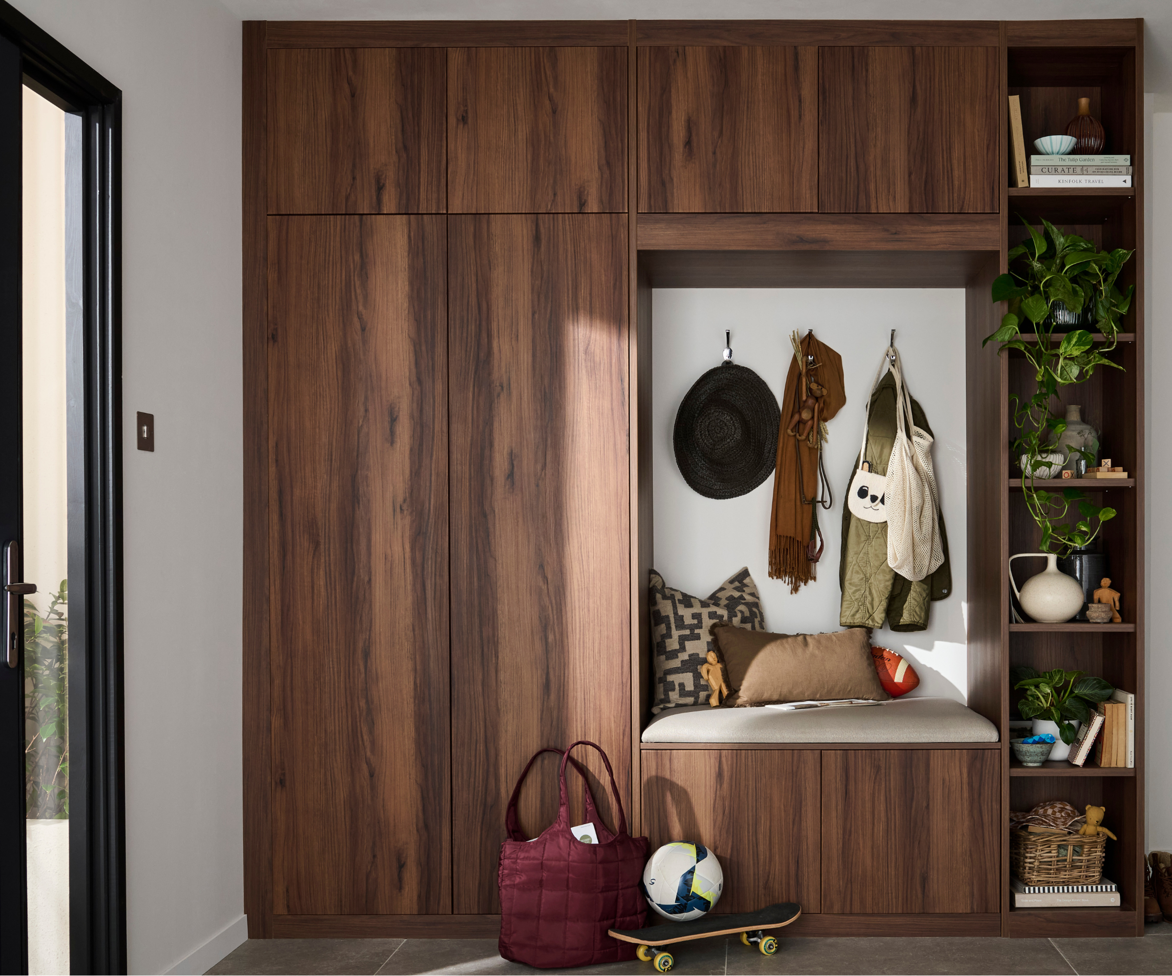 Hallway with built in storage with a seat
