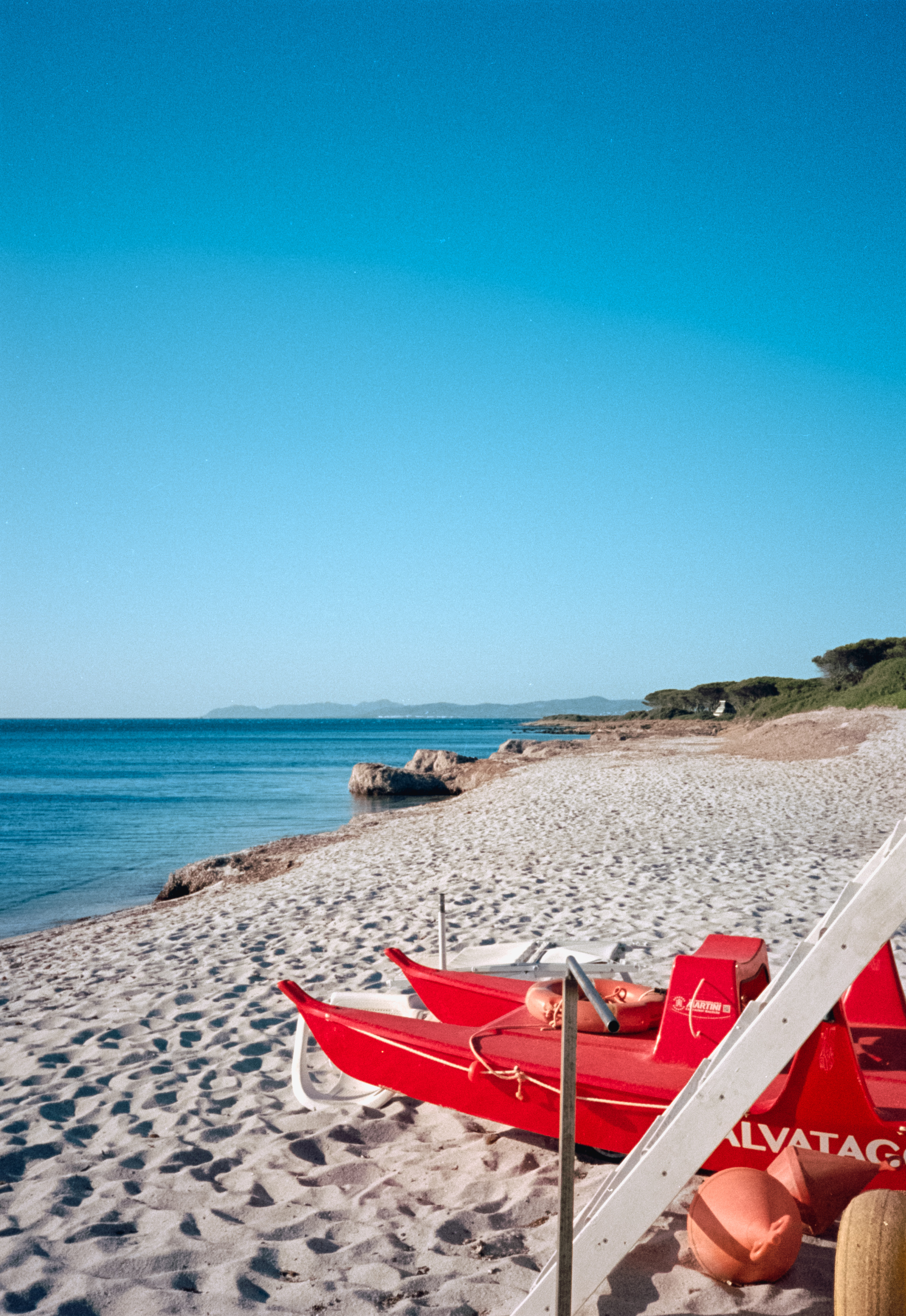 Sunny beach with a lifeguard station in the foreground
