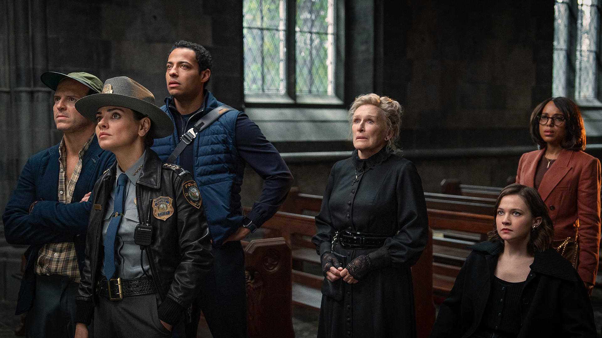 Members of the Knives Out 3 cast standing in a church