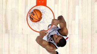 Jaedon LeDee #13 of the San Diego State Aztecs dunking the ball during NCAA March madness