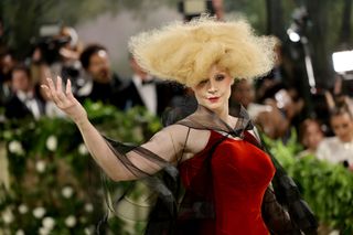 Gwendoline Christie extending her arm at the 2024 Met Gala