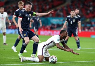 Challenges such as this one by Andy Robertson on Raheem Sterling during the Euros would not be given in the Premier League - on this one the UEFA officials agreed