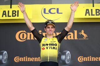 Wout van Aert on the Tour de France podium after winning stage 10