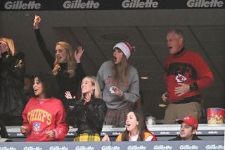 Brittany Mahomes (back row 2nd L), Taylor Swift, and Scott Swift cheer while watching the game between the Kansas City Chiefs and New England Patriots at Gillette Stadium