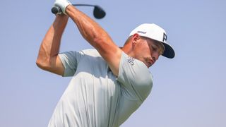 Bryson DeChambeau takes a shot in a practice round before the LIV Golf Jeddah tournament