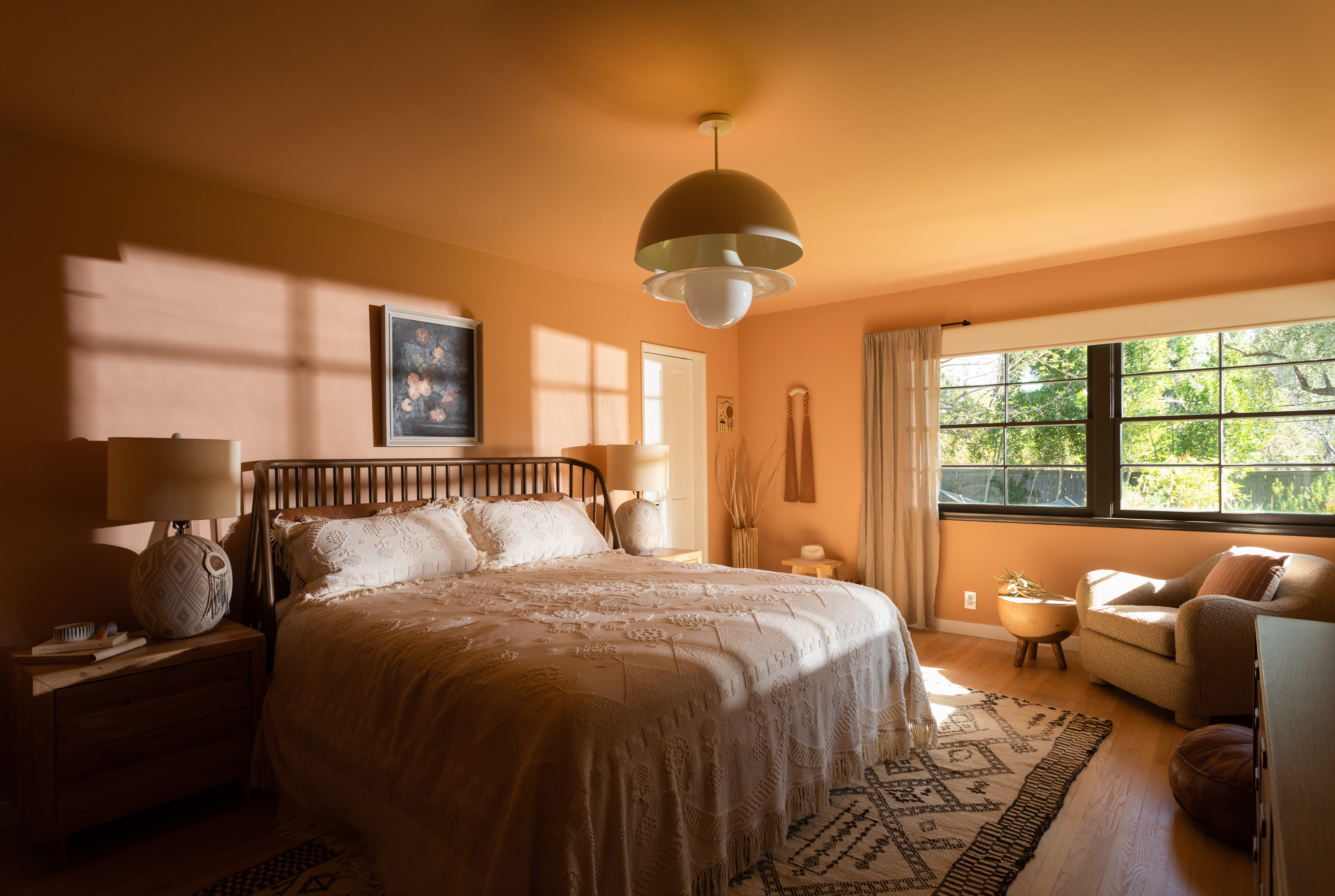 An earthy bedroom with yellow walls