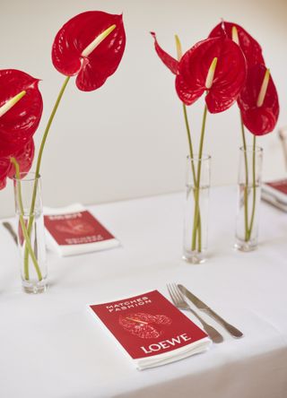 Anthurium flowers on table with Loewe menu