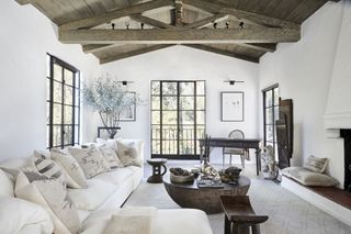 White living room with crittall windows picture lights