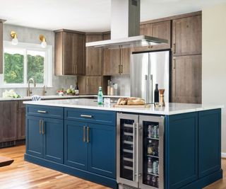 Blue and wooden kitchen with exposed appliances