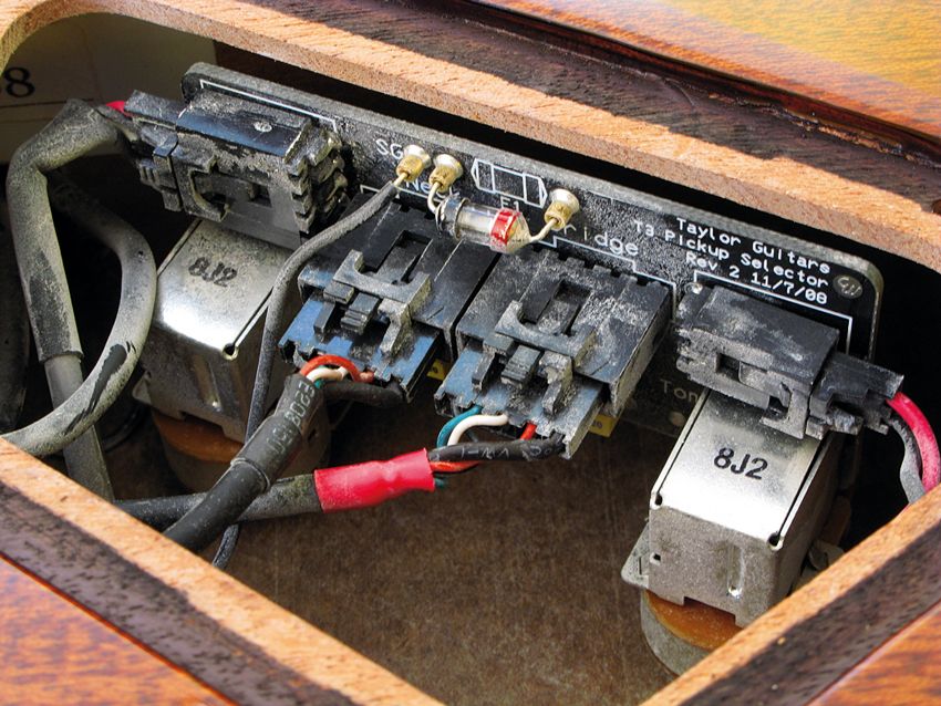 Not your average guitar wiring. Production models are less dusty than this prototype!