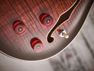 The beauty of the PRS SE is the easy drive, with volume and tone for the magnetic side and just volume for the piezo.