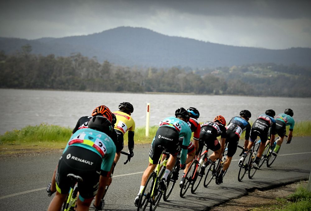 Riders pass the Tamar River.