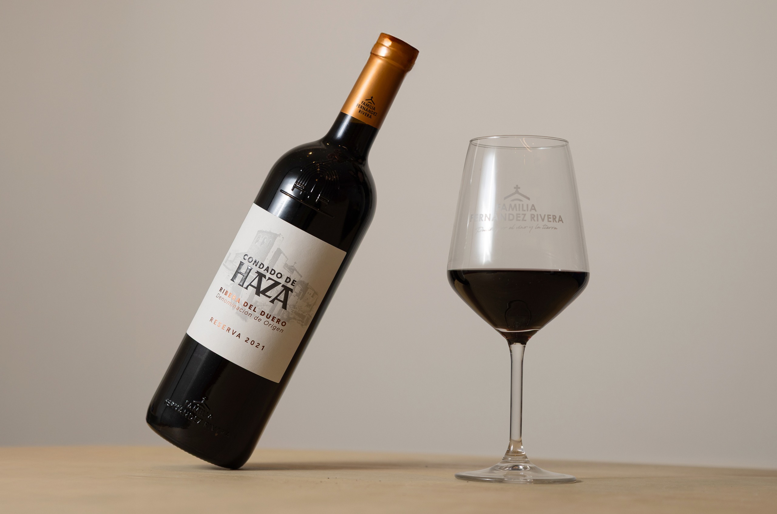 Bottle of red wine with wine glass