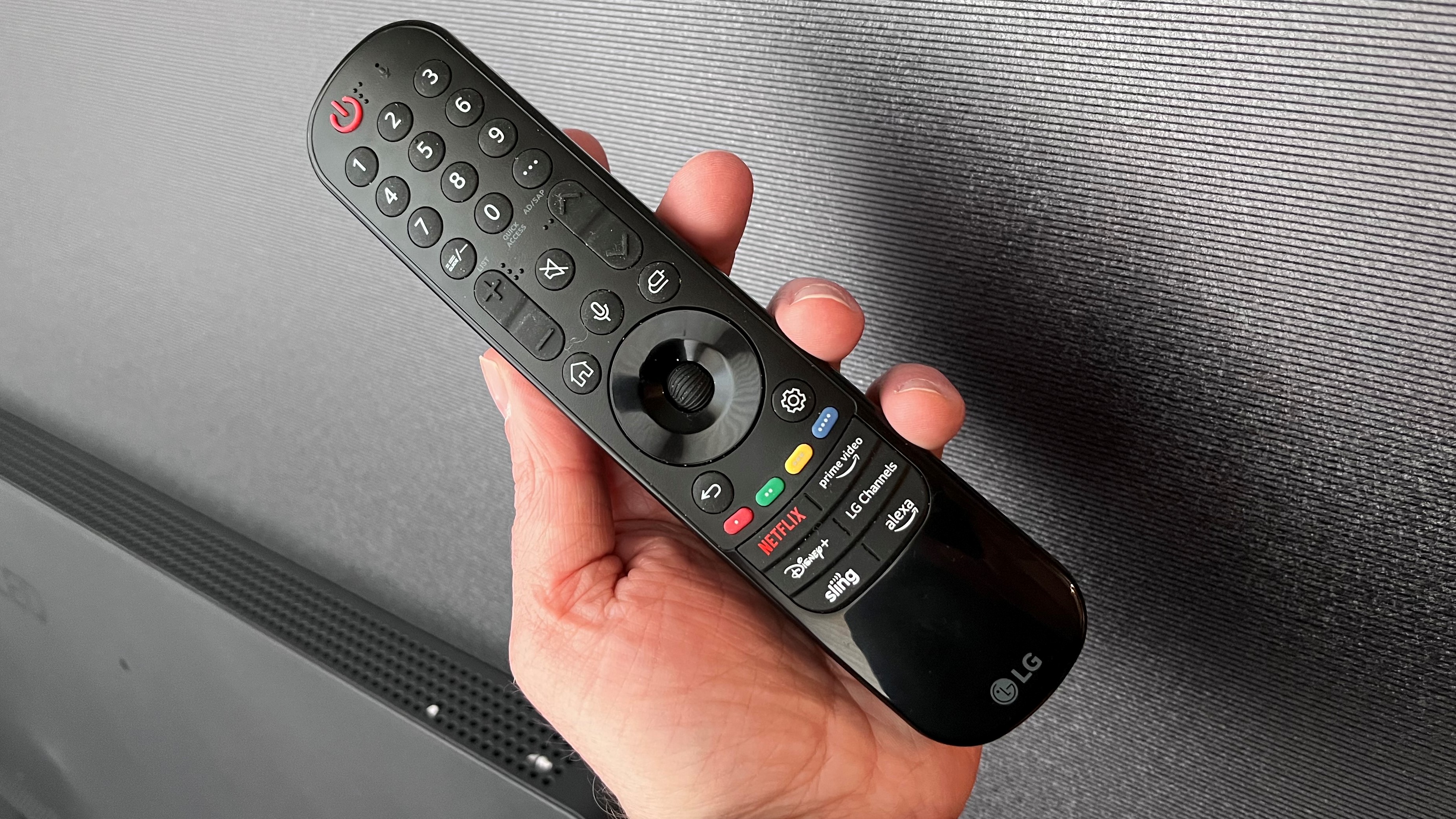 LG C3 OLED remote control held in hand