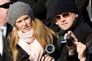 UNITED STATES - JANUARY 20: Actor Leonardo DiCaprio, right, and his girlfriend Bar Refaeli attend the inauguration ceremony of U.S. President Barack Obama at the Capitol in Washington, D.C., U.S., on Tuesday, Jan. 20, 2009. Obama was sworn-in as the 44th president of the United States. (Photo by Ken Cedeno/Bloomberg via Getty Images)