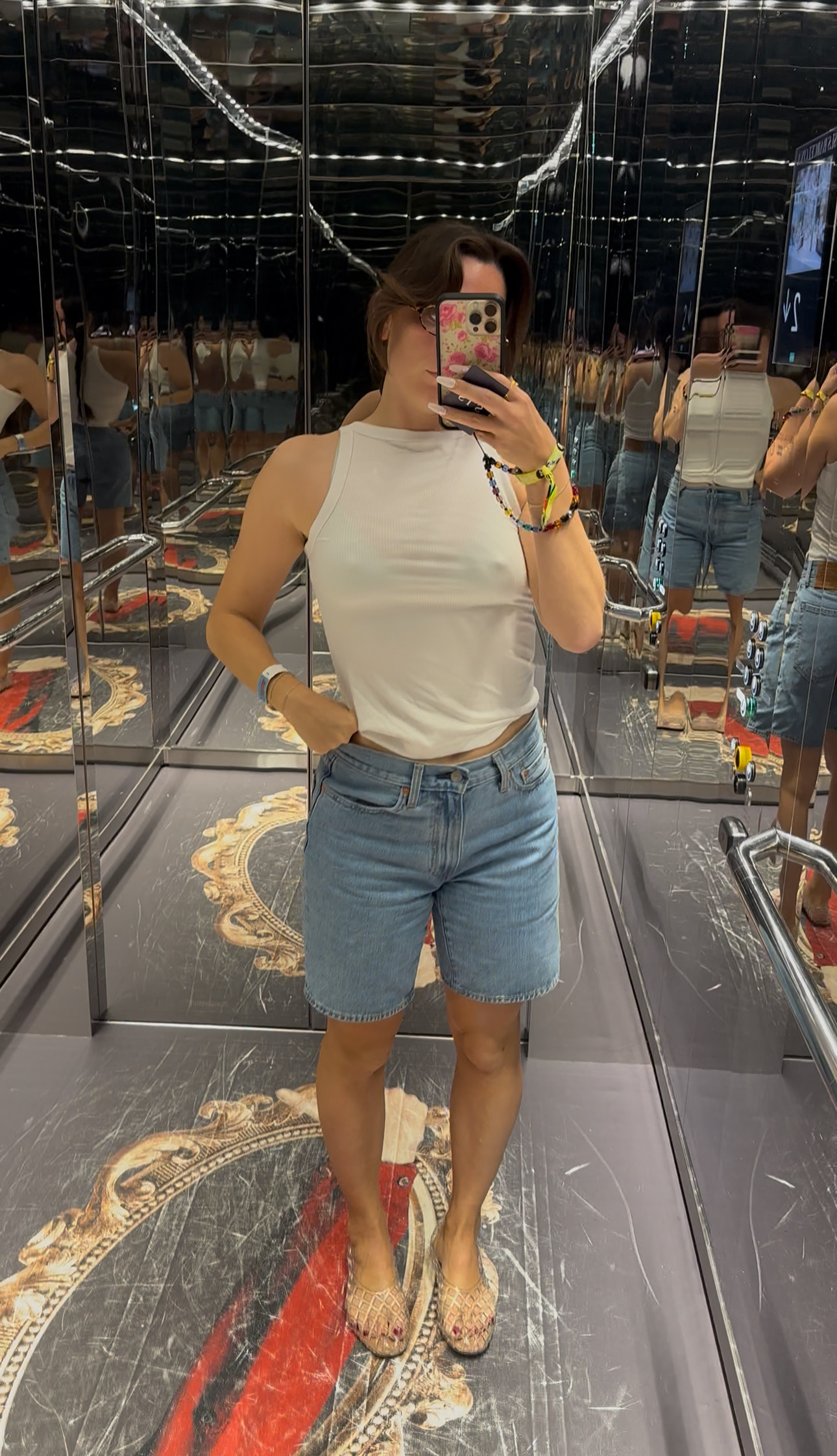Girl in clear shoes taking a selfie