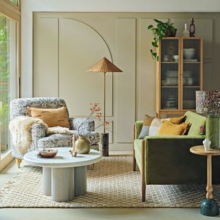 Green sofa with morris and co habitat chair and rattan lamp