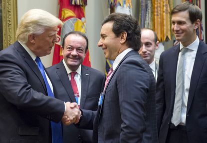 Donald Trump meets with auto industry executives.