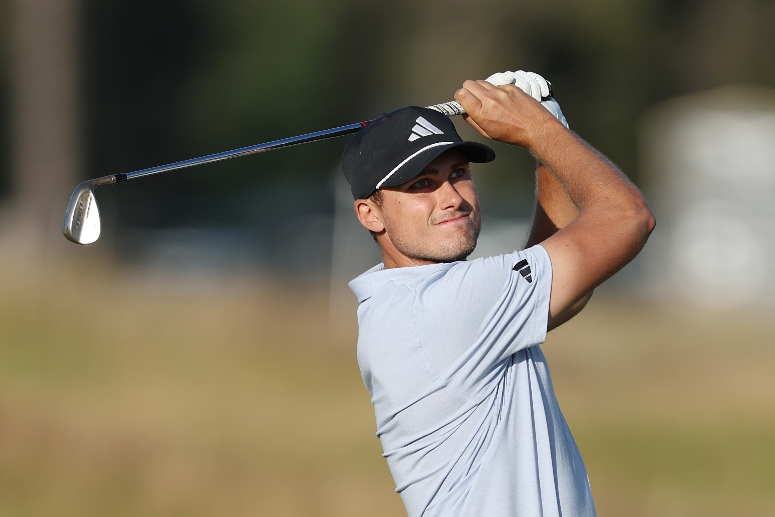 Ludvig Aberg hits a wedge shot