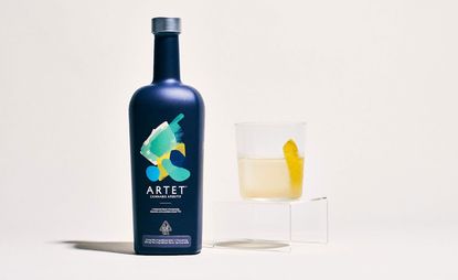 Artet non-alcoholic cannabis drink with glass against white background: part of a round-up of non-alcoholic drinks