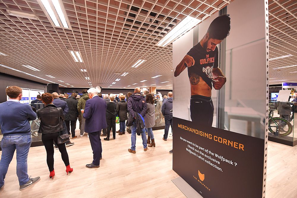 Specators and fans mingle during the team press conference at the Quick-Step Floors Pop-Up Store in the Ring Shopping Center in Kortrijk