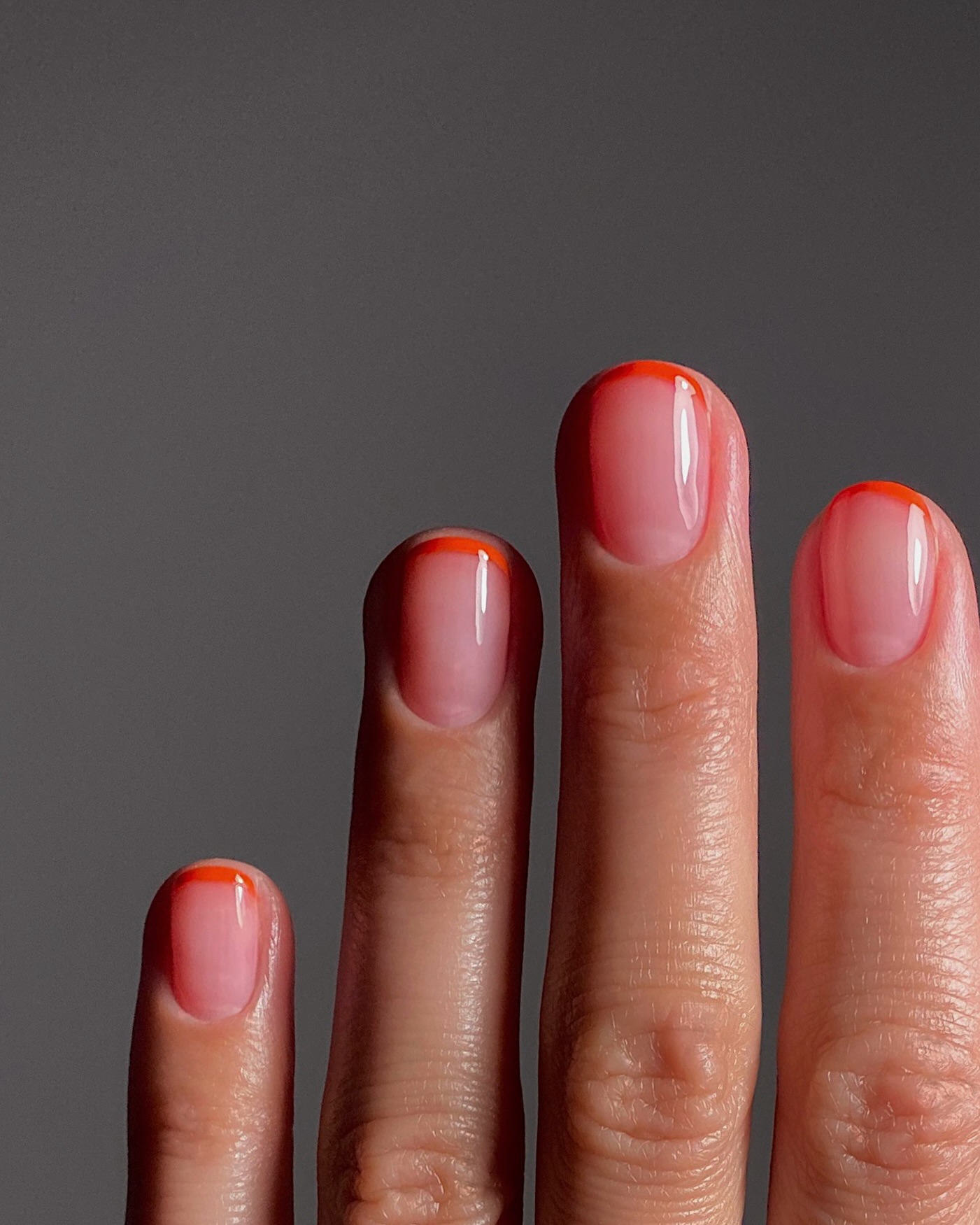Cranberry fruit water nails with orange French tips