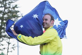 Steele von Hoff takes the Australian flag onto the podium