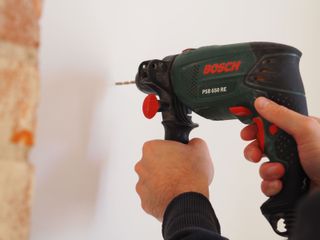 drilling into brick with a cordless drill