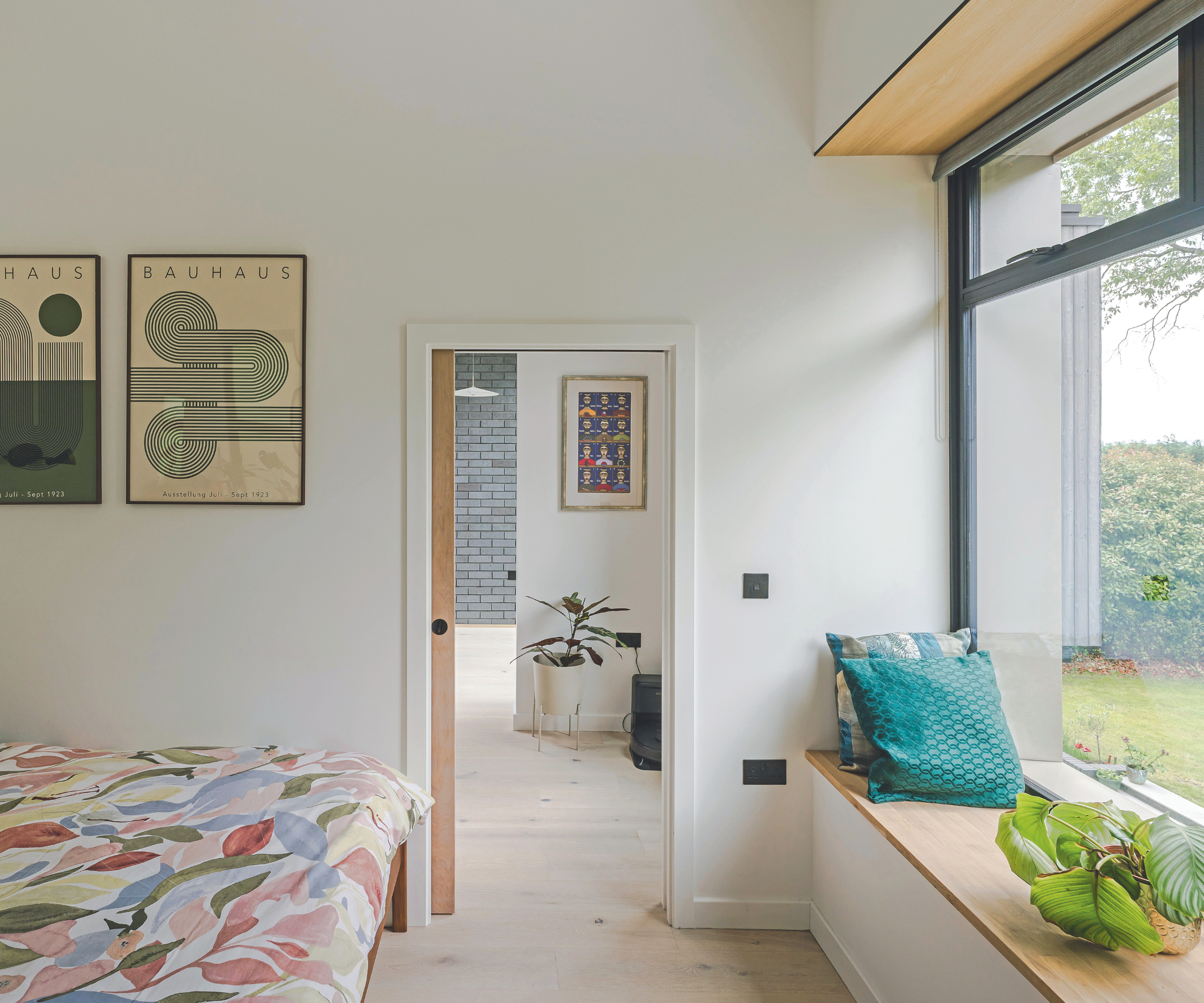 Bedroom with window seat overlooking the garden to the right