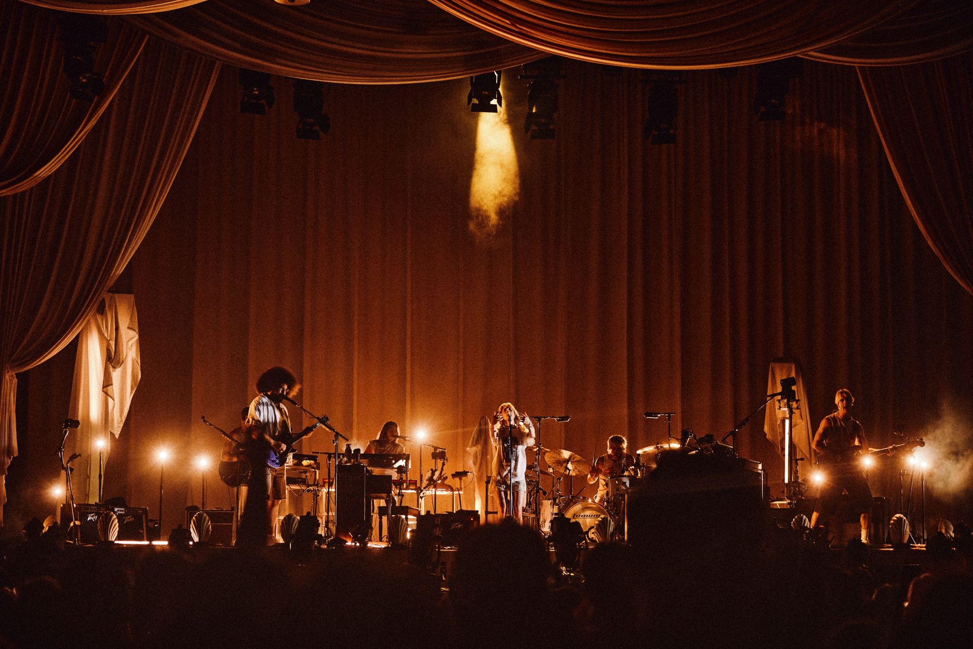 bands on stage in pink light