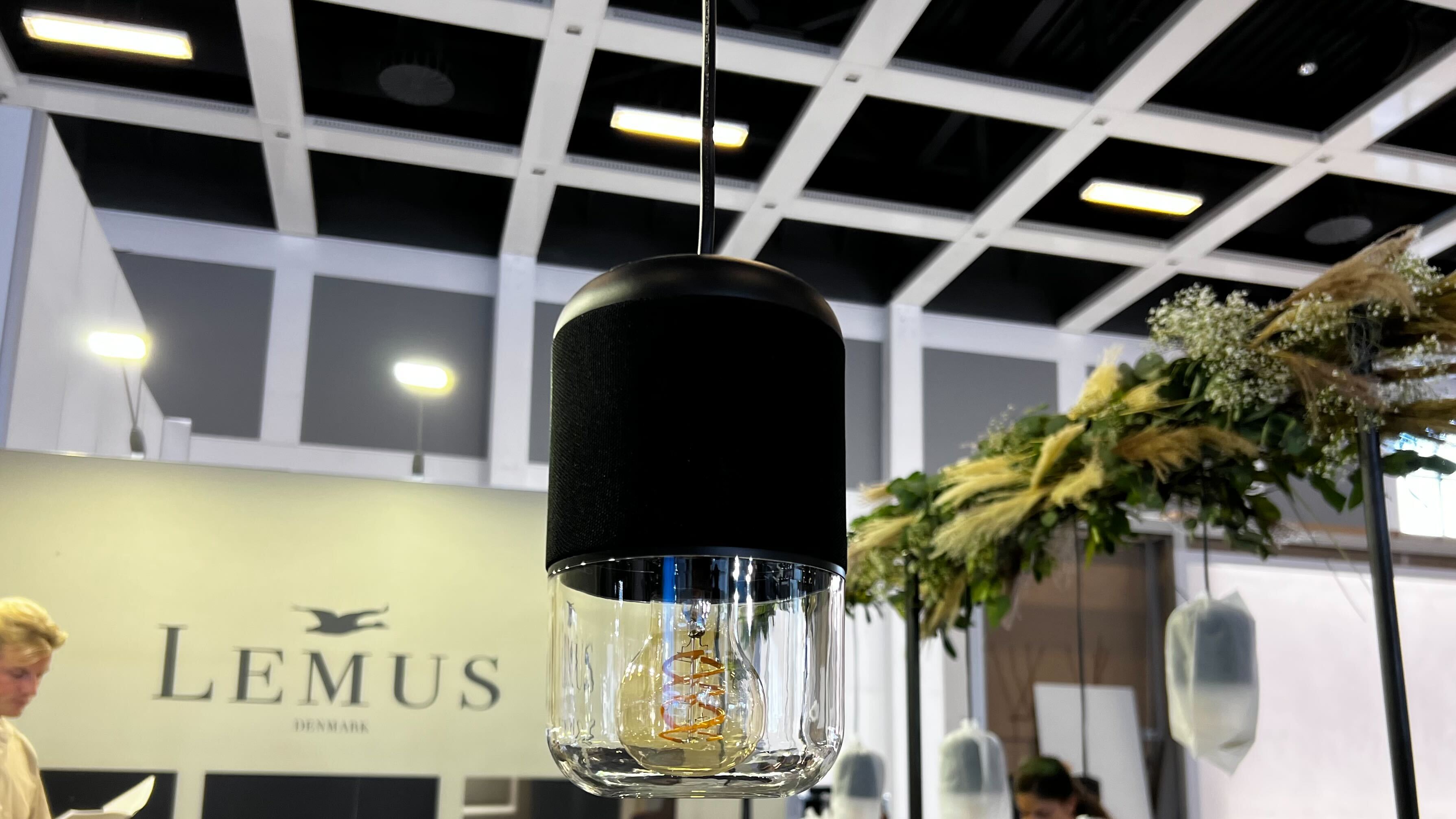 A Lemus Life light and speaker hanging from a ceiling at IFA 2023