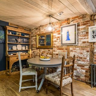 The kitchen of The Stable in Wiltshire with grey dining table