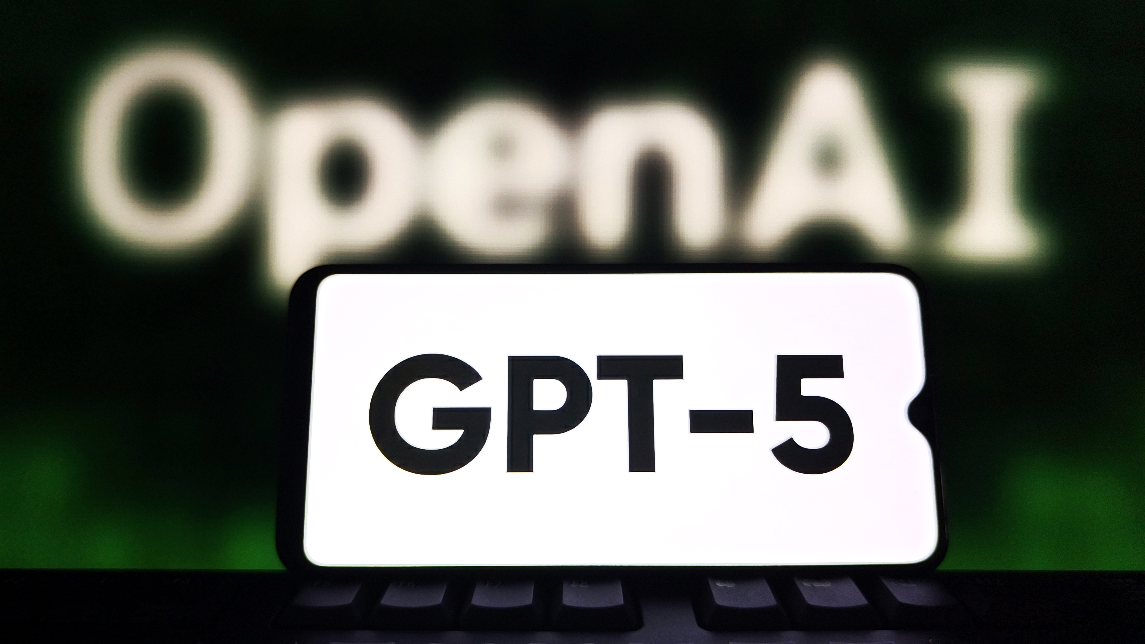 SUQIAN, CHINA - AUGUST 7, 2025 - A illustration photo shows the GPT-5 displayed in a smartphone with the OpenAI logo in background in Suqian, Jiangsu Province, China on August 7, 2025. (Photo credit should read CFOTO/Future Publishing via Getty Images)