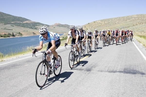 The peloton strings out as the pace picks up.