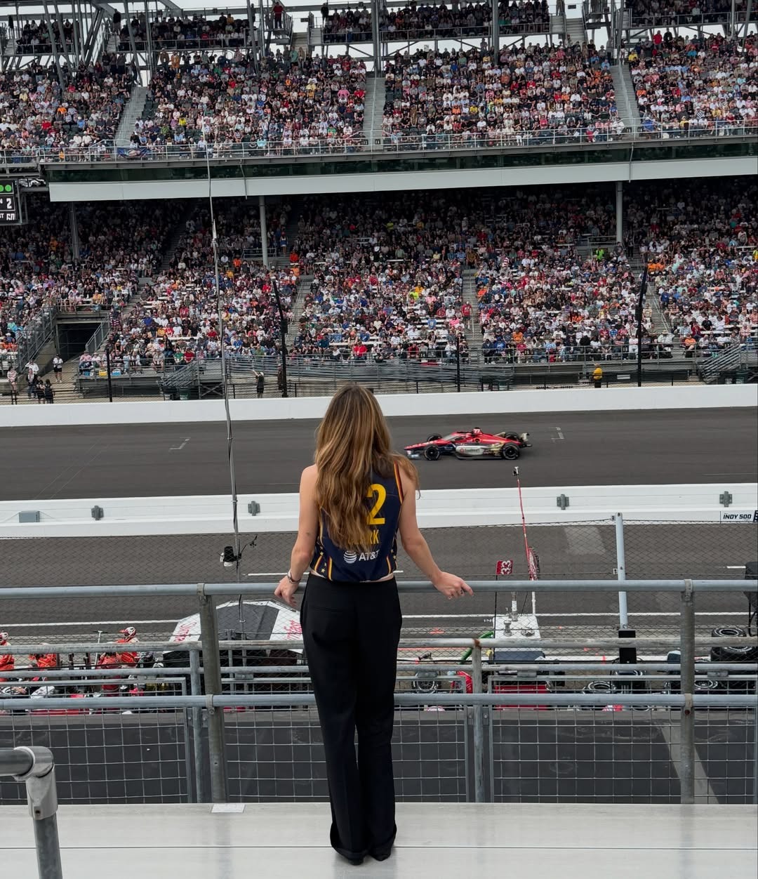 Eliza Huber wearing a Caitlin Clark jersey at the Indianapolis 500.