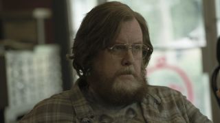 Steve Agee as John Economos in Peacemaker Season 1