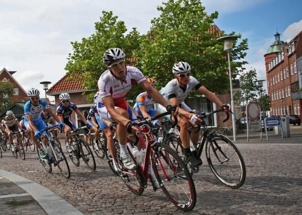 Riders corner through a town in Denmark.