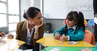 Meghan markle in a button down set