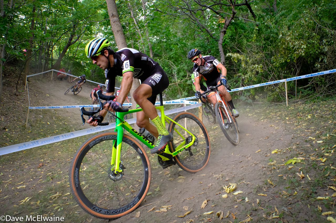 Jeremy Durrin (Neon Velo) riding a twisty section of the course in the forest.