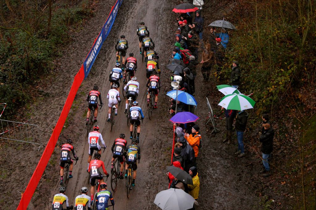 NAMUR BELGIUM DECEMBER 22 Thijs Aerts of Belgium and Team Telenet Baloise Lions Corne Van Kessel of The Netherlands and Team Telenet Baloise Lions Quinten Hermans of Belgium and Team Telenet Baloise Lions Lars Van Der Haar of The Netherlands and Team Telenet Baloise Lions Toon Aerts of Belgium and Team Telenet Baloise Lions Laurens Sweeck of Belgium and Team Pauwels Sauzen Bingoal Mathieu Van Der Poel of The Netherlands and Team Corendon Circus Eli Iserbyt of Belgium and Team Pauwel Sauzen Bingoal Tim Merlier of Belgium and Team Creafin Fristads Jens Adams of Belgium and Team Pauwels Sauzen Bingoal Jim Aernouts of Belgium and Team Telenet Baloise Lions Tom Meeusen of Belgium and Team Corendon Circus Joris Nieuwenhuis of The Netherlands and Team Sunweb Peloton Public Fans Mud during the 11th Namur World Cup 2019 UCICX TelenetUCICXWC on December 22 2019 in Namur Belgium Photo by Luc ClaessenGetty Images