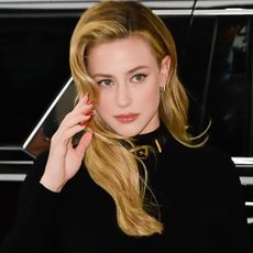 Lili Reinhart began her 'Forbidden Fruits' press tour in a vintage Versace little black dress