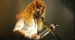 Dave Mustaine of Megadeth pictured playing a Jackson King V live in the '90s.