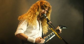 Dave Mustaine of Megadeth pictured playing a Jackson King V live in the '90s.