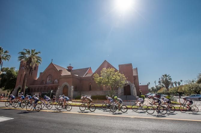 Peloton streaks passed the church on turn 5.