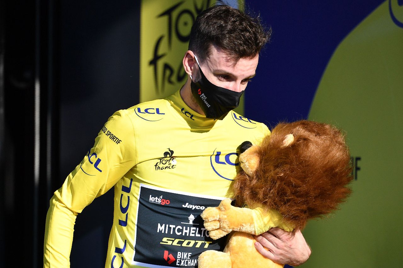 Great Britain's Adam Yates (Mitchelton-Scott) celebrates his overall leader yellow jersey on the podium at the end of stage 5