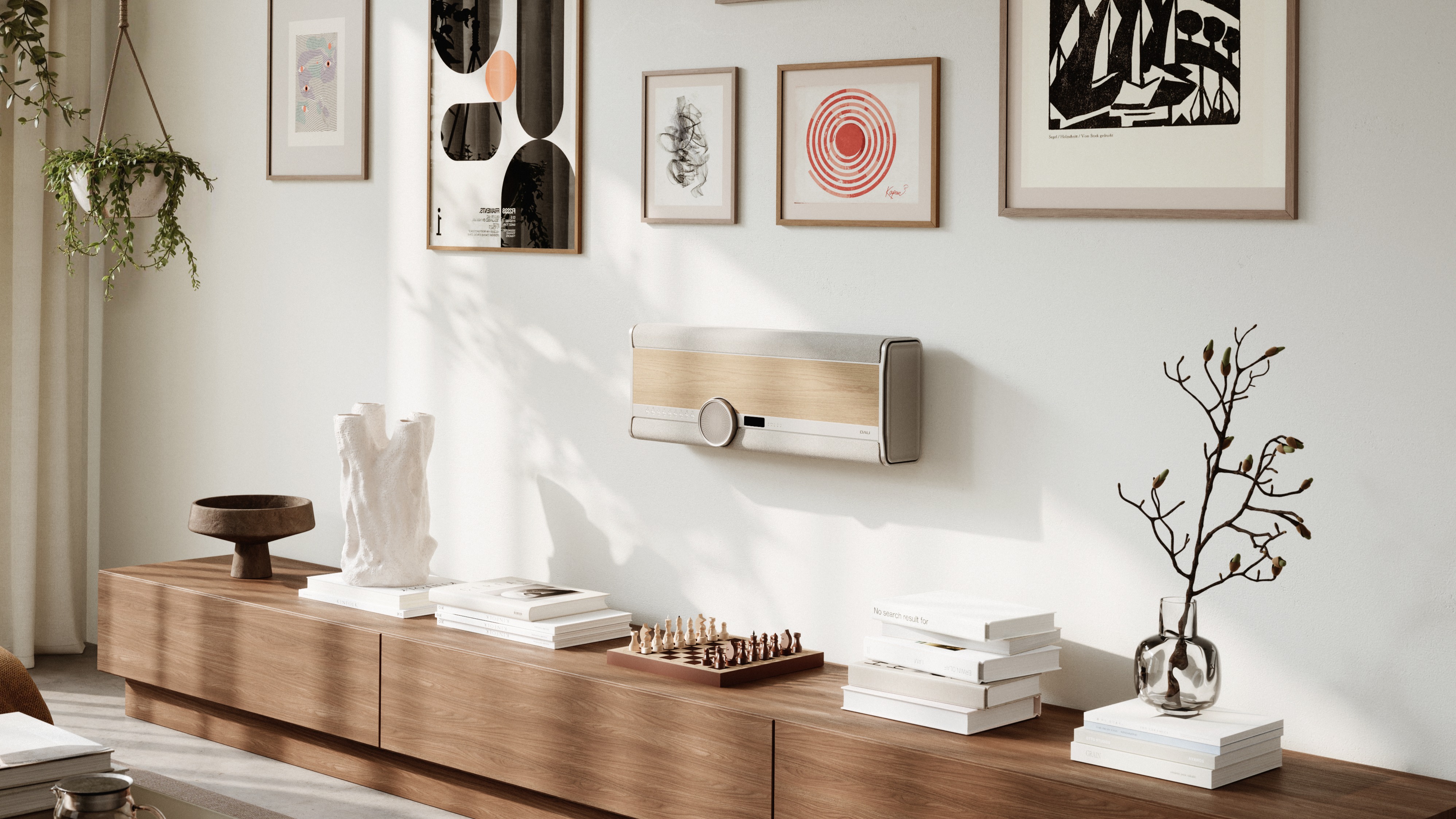 Dali Vega all-in-one speaker system in a Natural Oak finish mounted to a wall